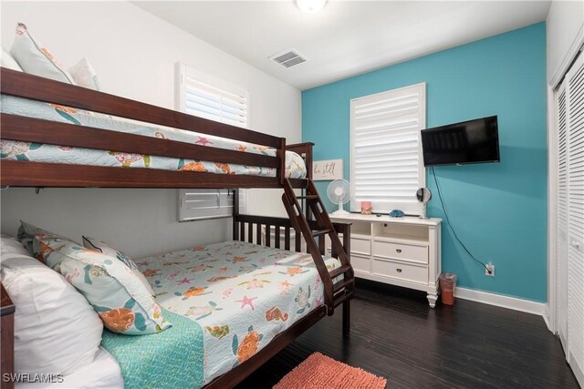 5105 Rutland Ct, Cape Coral, FL 33904 - bedroom featuring wood finished floors, baseboards, and a closet