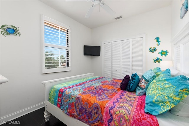 5105 Rutland Ct, Cape Coral, FL 33904 - bedroom with a closet, baseboards, a ceiling fan, and wood finished floors