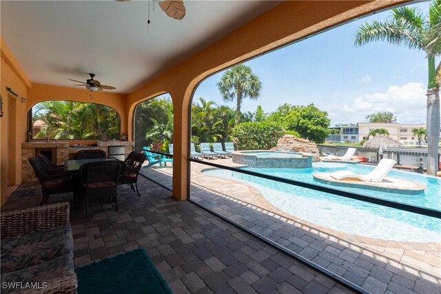 5105 Rutland Ct, Cape Coral, FL 33904 - view of patio featuring ceiling fan, outdoor dining space, and a pool with connected hot tub