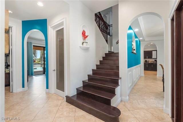 5105 Rutland Ct, Cape Coral, FL 33904 - stairway with arched walkways, tile patterned floors, and recessed lighting