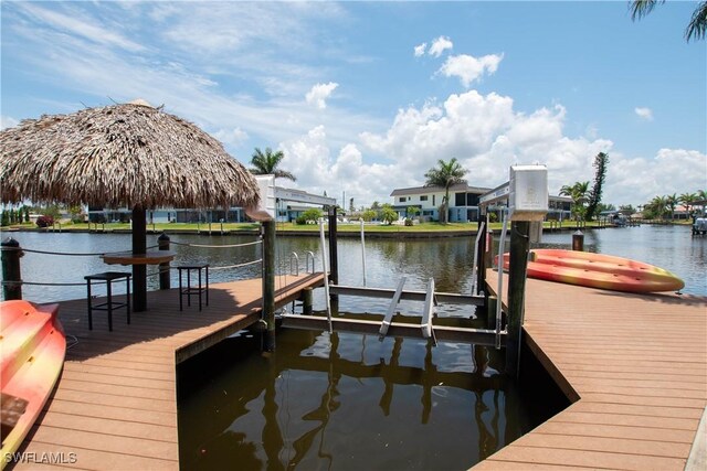 5105 Rutland Ct, Cape Coral, FL 33904 - dock with boat lift and a water view