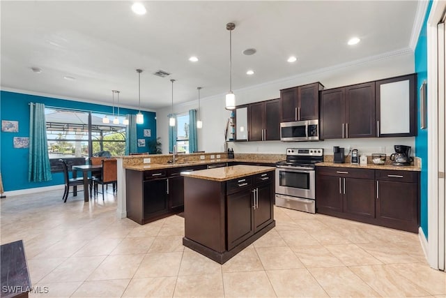 5105 Rutland Ct, Cape Coral, FL 33904 - kitchen featuring stainless steel appliances, crown molding, a peninsula, pendant lighting, and dark brown cabinetry