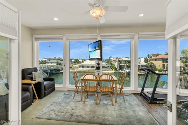 sunroom featuring a residential view