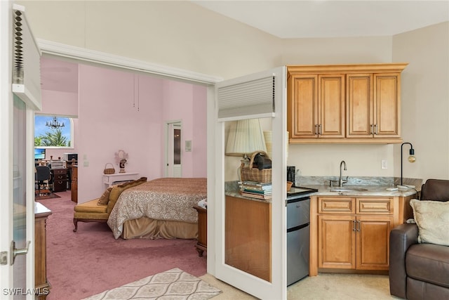 kitchen featuring a sink, fridge, open floor plan, and light colored carpet