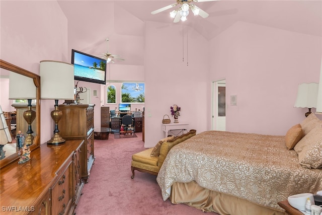 carpeted bedroom with high vaulted ceiling and a desk