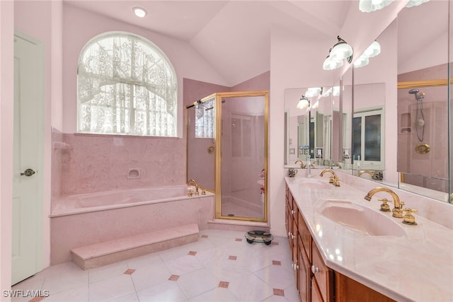 bathroom with a stall shower, a garden tub, double vanity, lofted ceiling, and tile patterned flooring