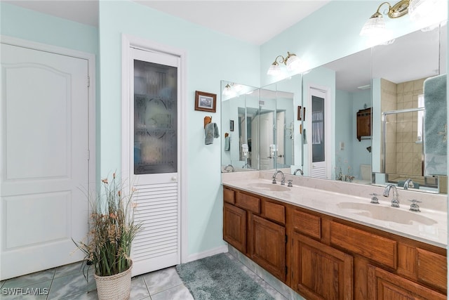 bathroom featuring a stall shower, double vanity, and tile patterned flooring