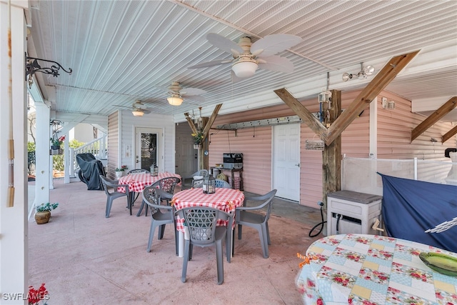 view of patio featuring outdoor dining space and ceiling fan