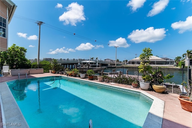 swimming pool with a boat dock and boat lift