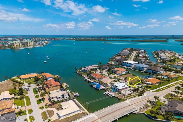 aerial view of residential area with a large body of water