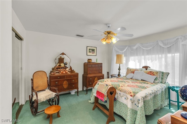 bedroom featuring a closet, carpet, and ceiling fan