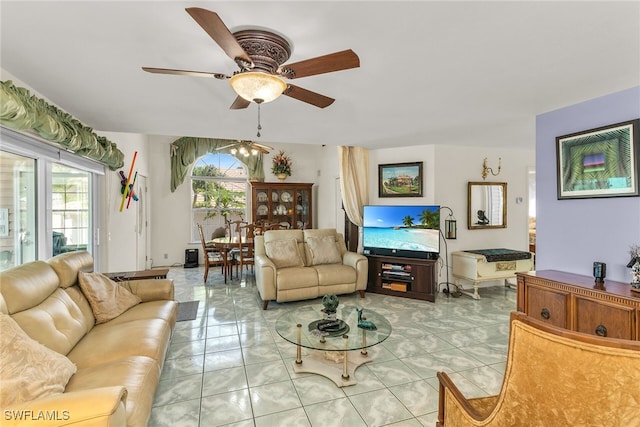 living area with ceiling fan