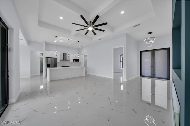unfurnished living room featuring coffered ceiling, baseboards, french doors, recessed lighting, and light marble finish floors