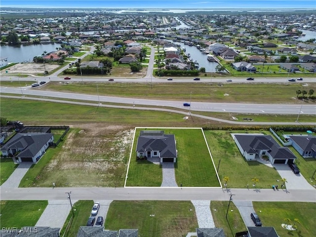 aerial perspective of suburban area with a large body of water