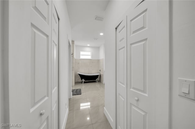 hall featuring recessed lighting