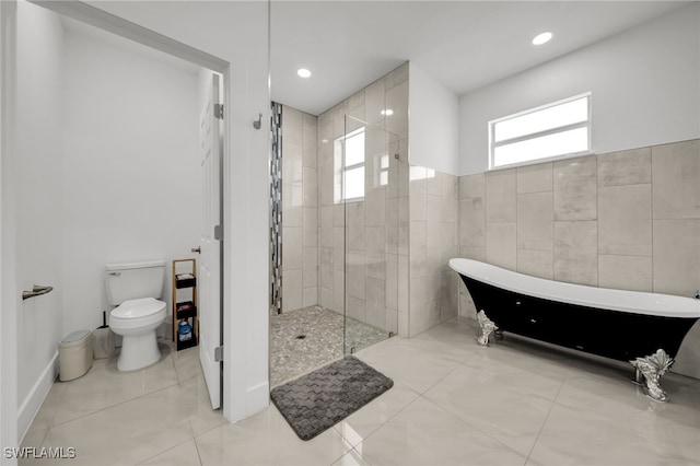 bathroom with tiled shower, a soaking tub, toilet, and recessed lighting