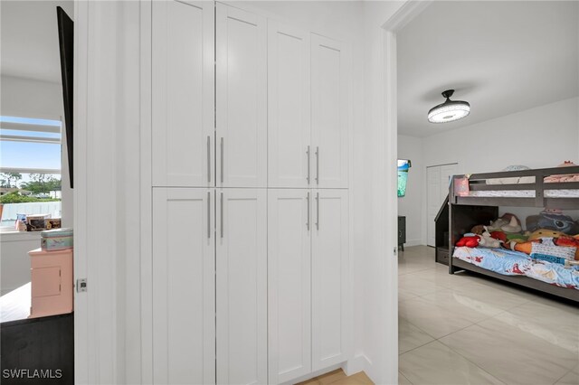 bedroom featuring light tile patterned floors
