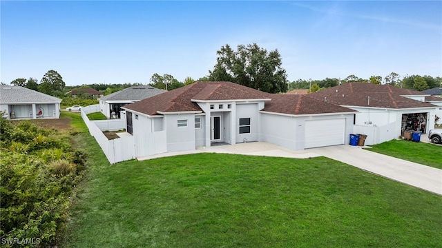 view of front of house featuring concrete driveway, a garage, and stucco siding