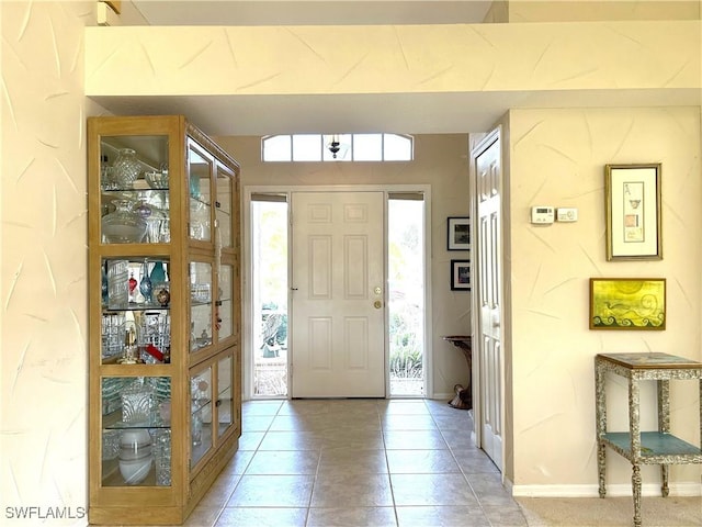 entrance foyer with light tile patterned floors