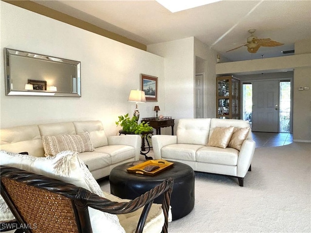 living room featuring carpet floors and a ceiling fan