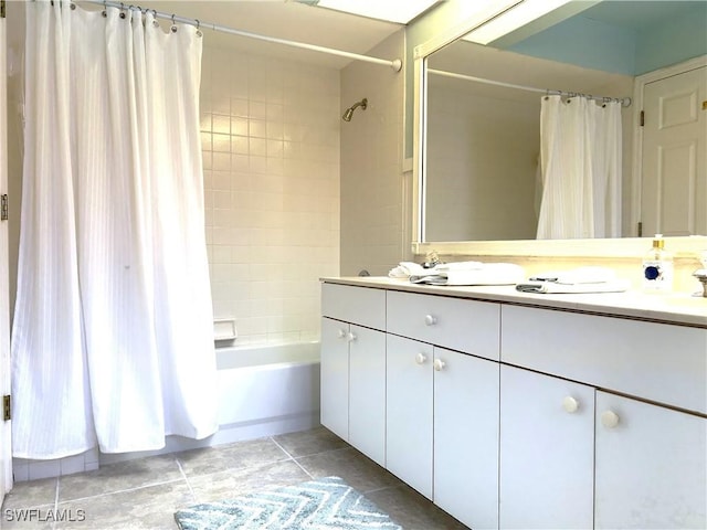bathroom with vanity, shower / bath combination with curtain, and tile patterned flooring