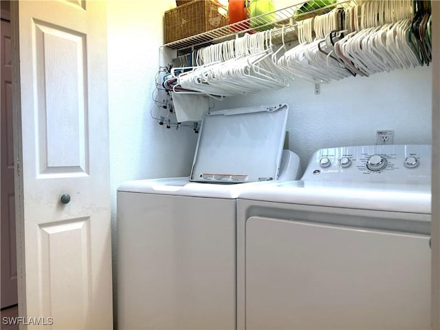 washroom featuring independent washer and dryer