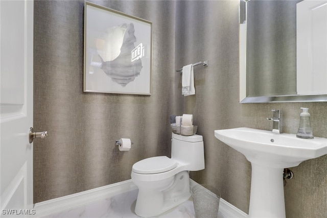 14179 Charthouse Ct, Naples, FL 34114 - bathroom featuring toilet and marble look tile flooring