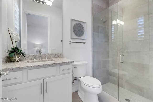 14179 Charthouse Ct, Naples, FL 34114 - bathroom with toilet, a stall shower, and vanity