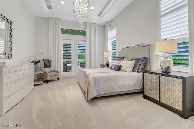 14179 Charthouse Ct, Naples, FL 34114 - bedroom with light carpet, access to exterior, french doors, a chandelier, and a raised ceiling