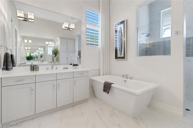 14179 Charthouse Ct, Naples, FL 34114 - bathroom featuring marble finish floors, a walk in shower, vanity, and a freestanding bath