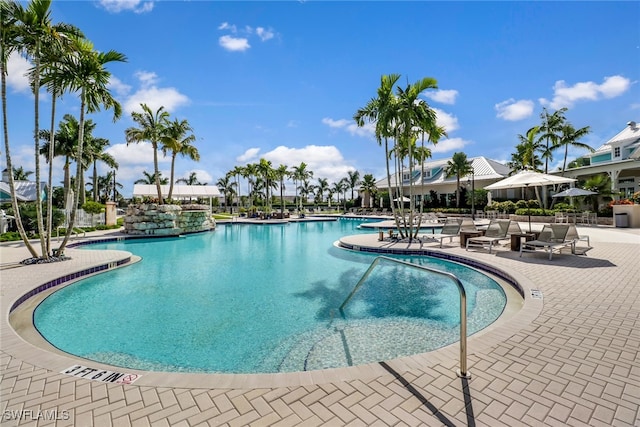 14179 Charthouse Ct, Naples, FL 34114 - community pool featuring a patio