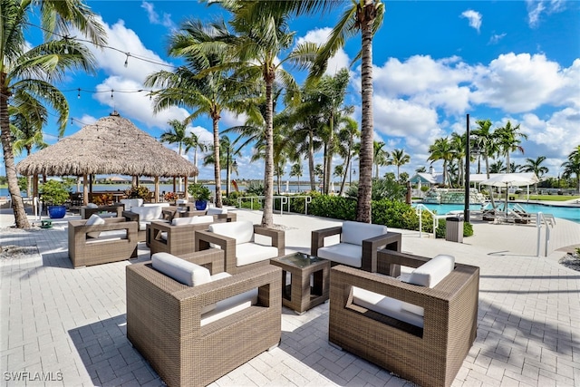 14179 Charthouse Ct, Naples, FL 34114 - view of property's community with a gazebo, an outdoor hangout area, a pool, and a patio