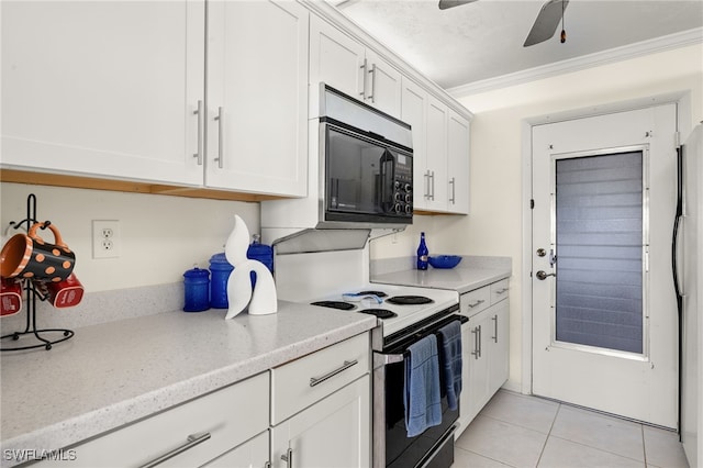 2150 Gulf Shore Blvd N Unit 701, Naples, FL 34103 - kitchen with black microwave, range with electric cooktop, white cabinets, light tile patterned floors, and ceiling fan