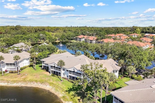 aerial view of residential area featuring a large body of water