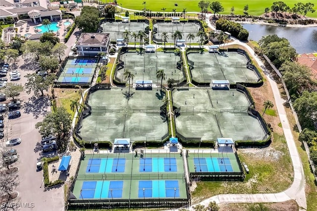 bird's eye view of a pool area and a large body of water
