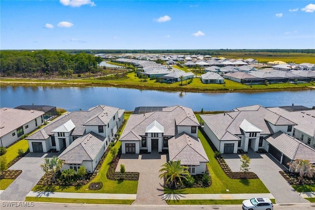aerial view of residential area with a nearby body of water