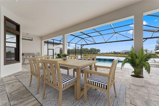 view of patio / terrace with an outdoor pool, a lanai, and outdoor dining space