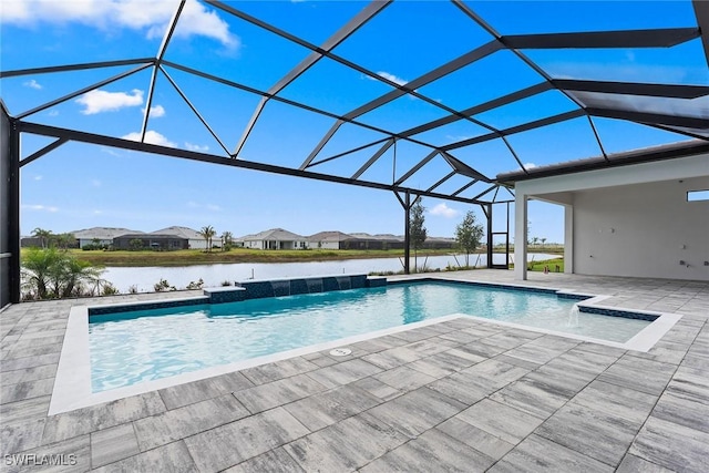 outdoor pool featuring a patio area, glass enclosure, and a water view
