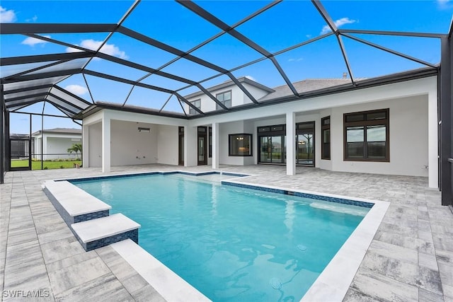swimming pool with a patio area and a lanai