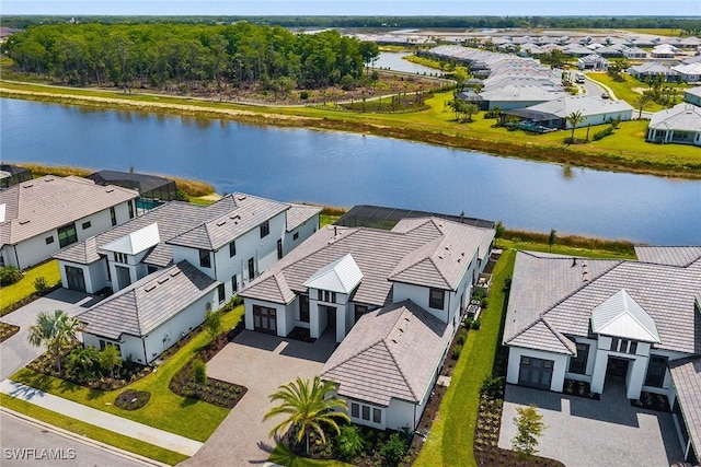 aerial view of residential area featuring a nearby body of water