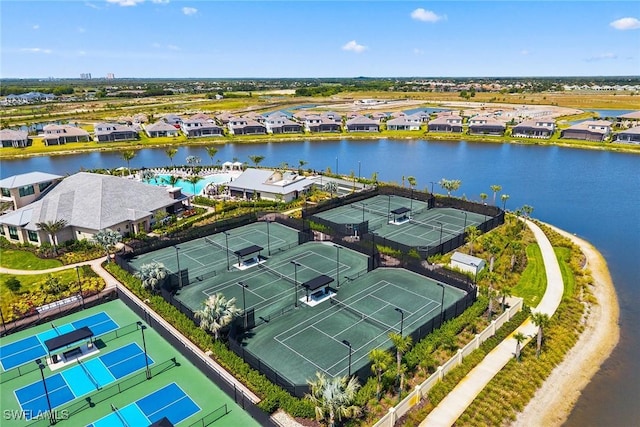 aerial view of residential area featuring a large body of water