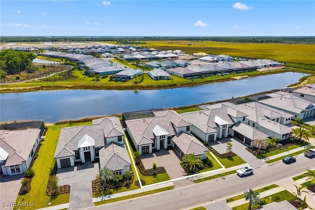 aerial perspective of suburban area featuring a large body of water
