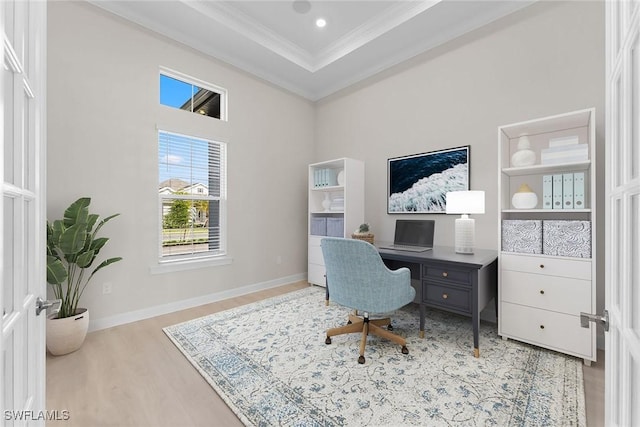 home office featuring ornamental molding, wood finished floors, and baseboards