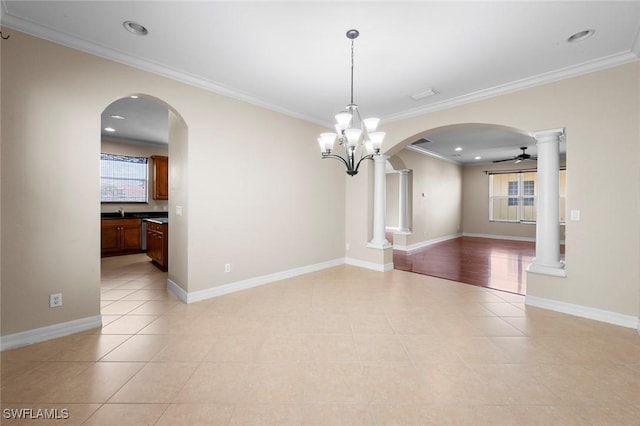 10310 Carolina Willow Dr, Fort Myers, FL 33913 - empty room with crown molding, arched walkways, decorative columns, light tile patterned floors, and ceiling fan
