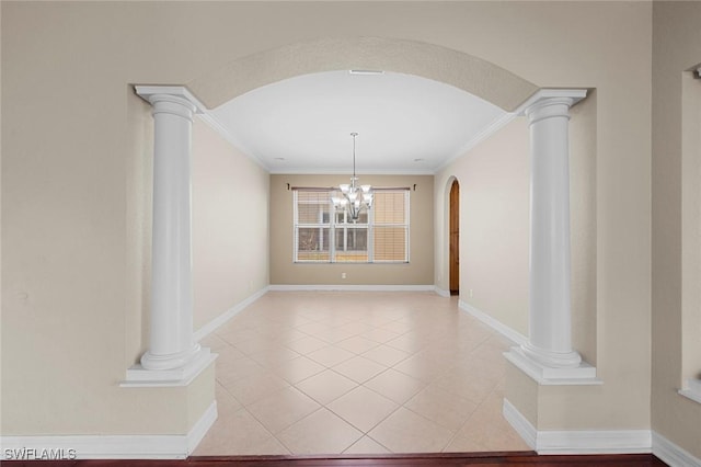 10310 Carolina Willow Dr, Fort Myers, FL 33913 - unfurnished dining area with ornate columns, arched walkways, ornamental molding, baseboards, and a chandelier