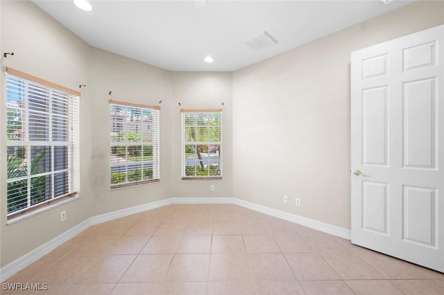 10310 Carolina Willow Dr, Fort Myers, FL 33913 - empty room featuring light tile patterned floors, baseboards, and recessed lighting