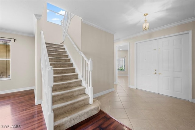 10310 Carolina Willow Dr, Fort Myers, FL 33913 - foyer with stairs, ornamental molding, baseboards, and tile patterned floors