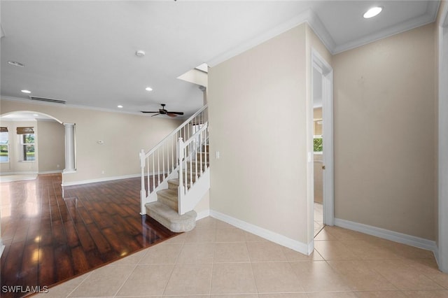 10310 Carolina Willow Dr, Fort Myers, FL 33913 - staircase with decorative columns, arched walkways, crown molding, a ceiling fan, and recessed lighting