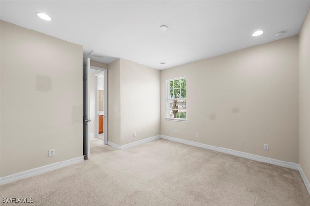 10310 Carolina Willow Dr, Fort Myers, FL 33913 - spare room with light colored carpet, baseboards, recessed lighting, and a smoke detector