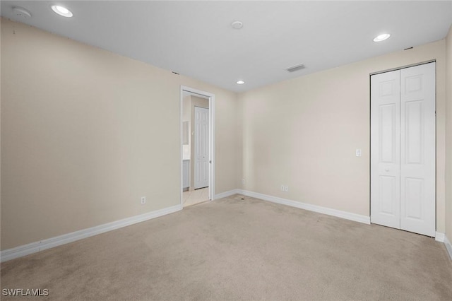 10310 Carolina Willow Dr, Fort Myers, FL 33913 - unfurnished bedroom with light carpet, recessed lighting, baseboards, and a closet